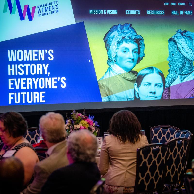 Gala screen projects Massachusetts Women's History Center.