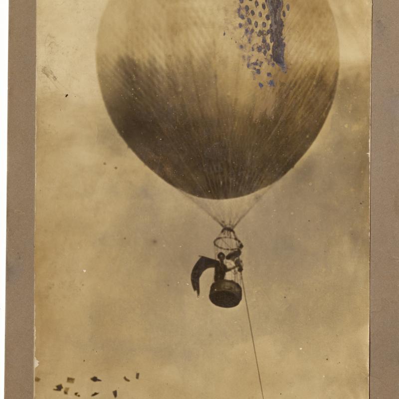 Margaret Foley in hot air balloon distributing suffrage pamphlets
