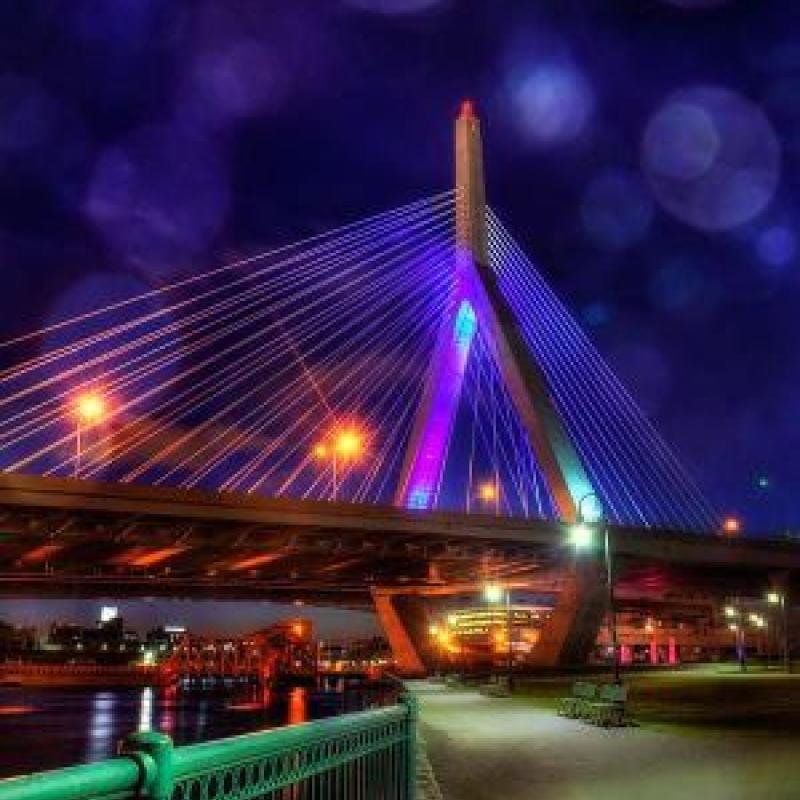 Bridge at night lit purple.
