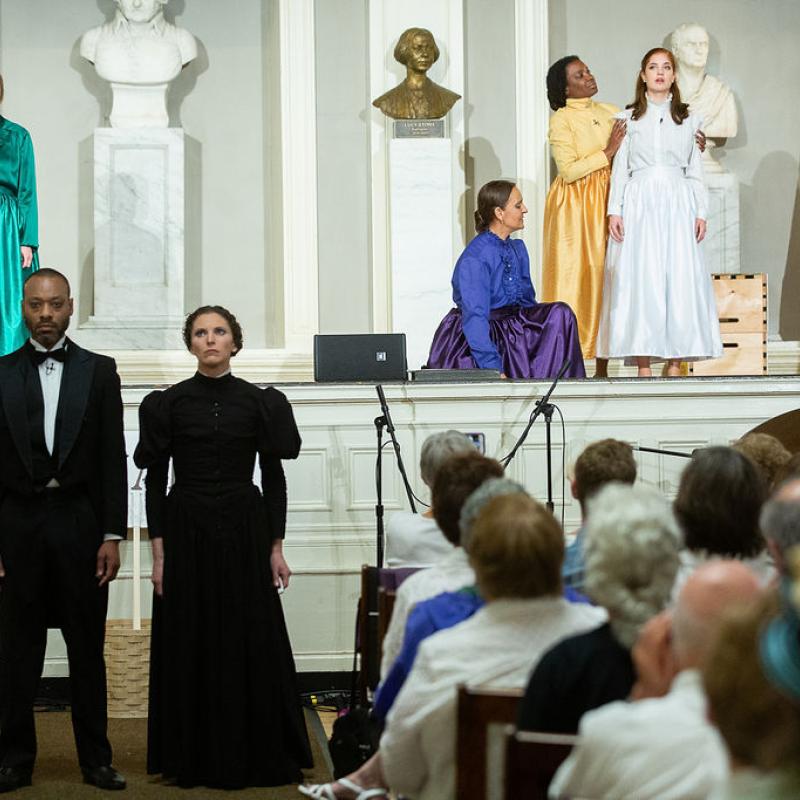 Group of performers on stage.