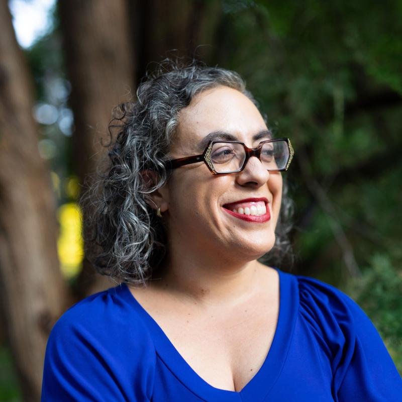 headshot of Suzanne Fischer sitting outside and smiling