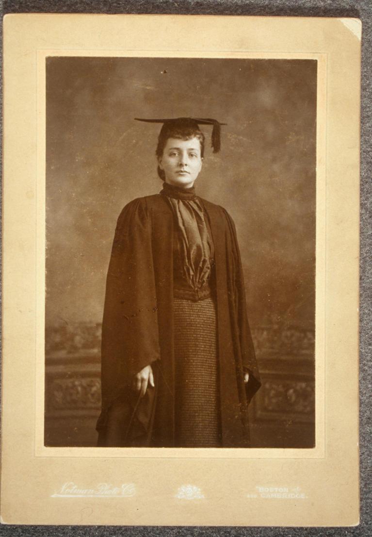 Black and white portrait of Maud Wood Park wearing graduation cap and gown.