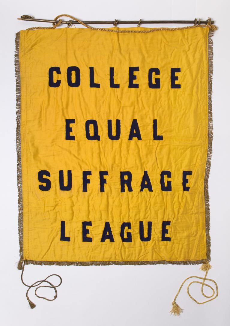 Old yellow banner with text, "College Equal Suffrage League."
