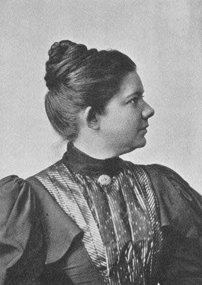 Black and white portrait of woman's profile.