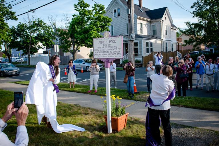 Nora Whouley (left) and Sheila Cooke-Kayser unveil the Anne L. Page suffrage trail marker in Danvers.