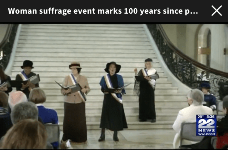 News clip of women standing on Sate House steps.